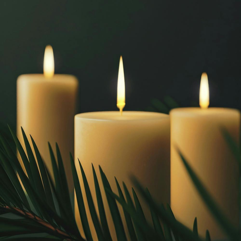 Three Candles On A Dark Background