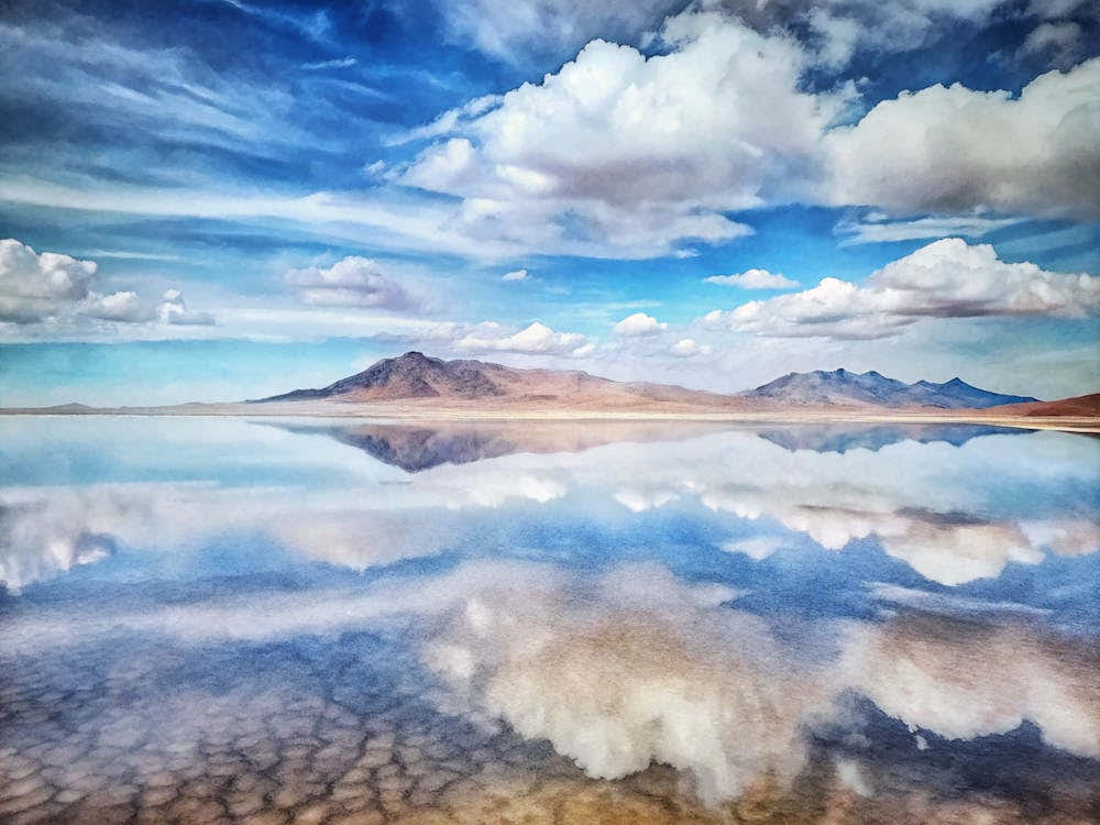 A Striking Image Of Salt Flats Reflecting The Sky