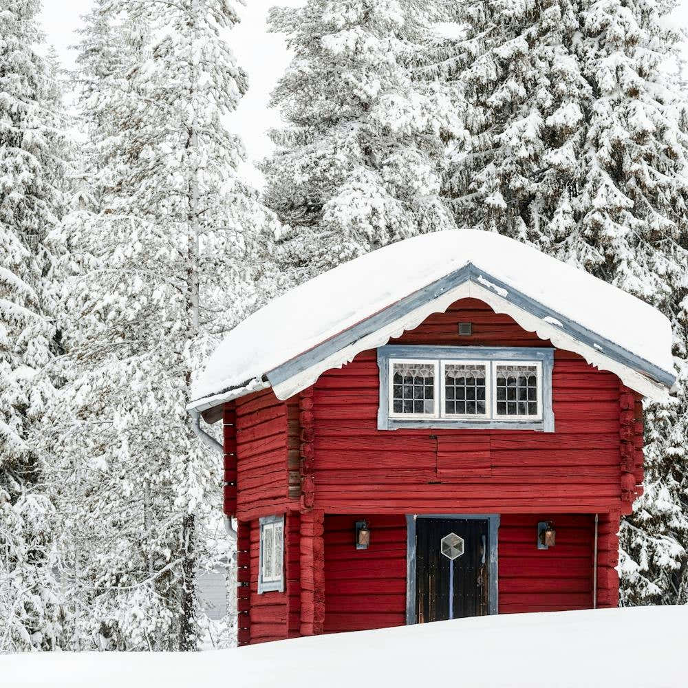 Small Log Cabin In The Snow