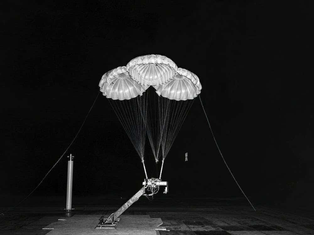 Black And White Negative Photograph Of Apollo 3 Parachute Cluster