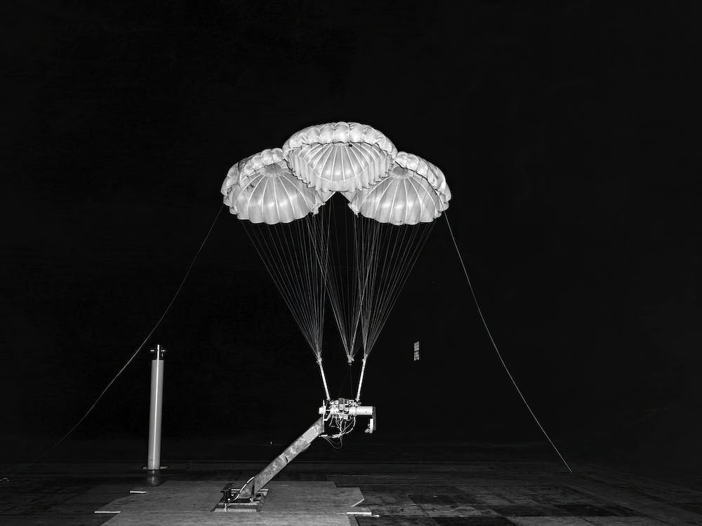 Black And White Negative Photograph Of Apollo 3 Parachute Cluster