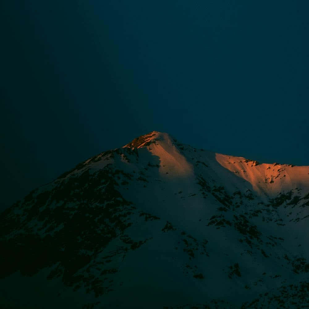 Alpenglow In The Alps of Europe Moody Minimalist Dark Blue And Orange Sunset Square