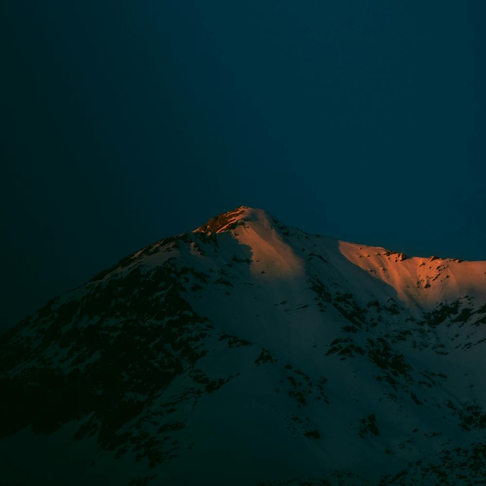 Alpenglow In The Alps of Europe Moody Minimalist Dark Blue And Orange Sunset Square
