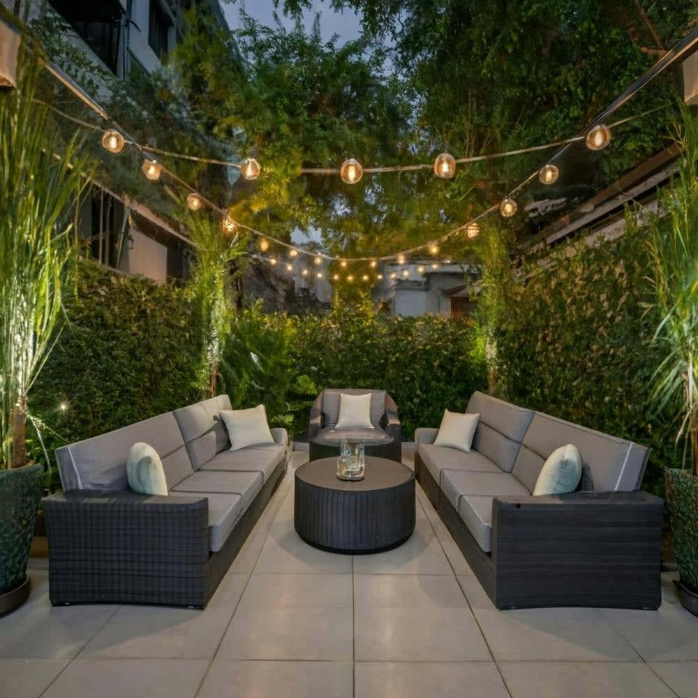 An inviting and well-designed outdoor space with comfortable seating, lush greenery, and ambient lighting, representing a welcoming atmosphere for patrons. This image is versatile and can be applied across various industries, such as hospitality, real est