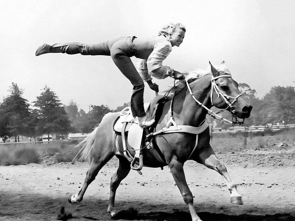 Cowgirl Trick Riding A Horse, Black and White Old Photo, Vintage Cowgirl