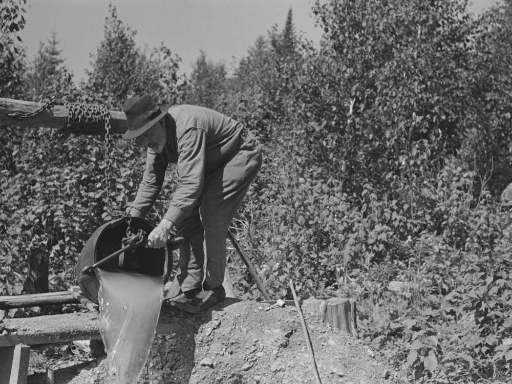 William Besson Dumping Water From Shaft Near Winton, Minnesota By Russell Lee