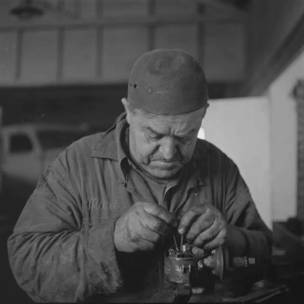 Burley, Idaho, Mechanic In Garage By Russell Lee