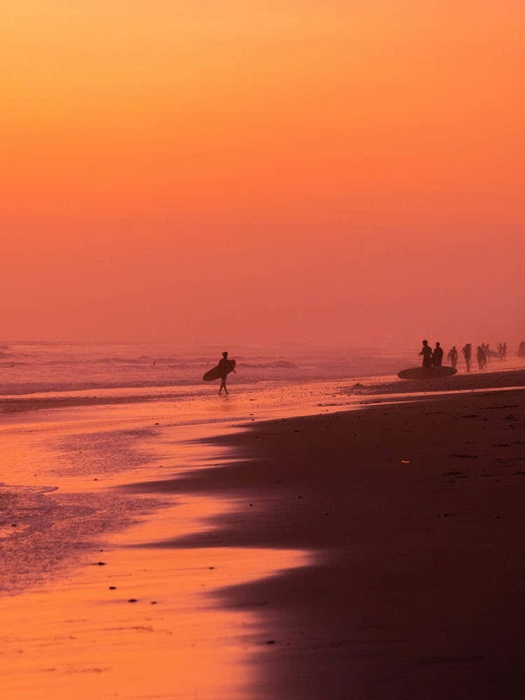 Surfer During Vibrant Sunset