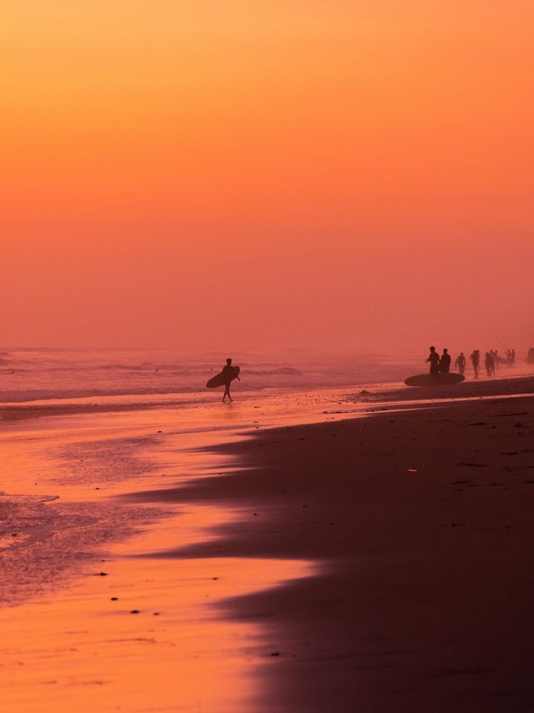Surfer During Vibrant Sunset