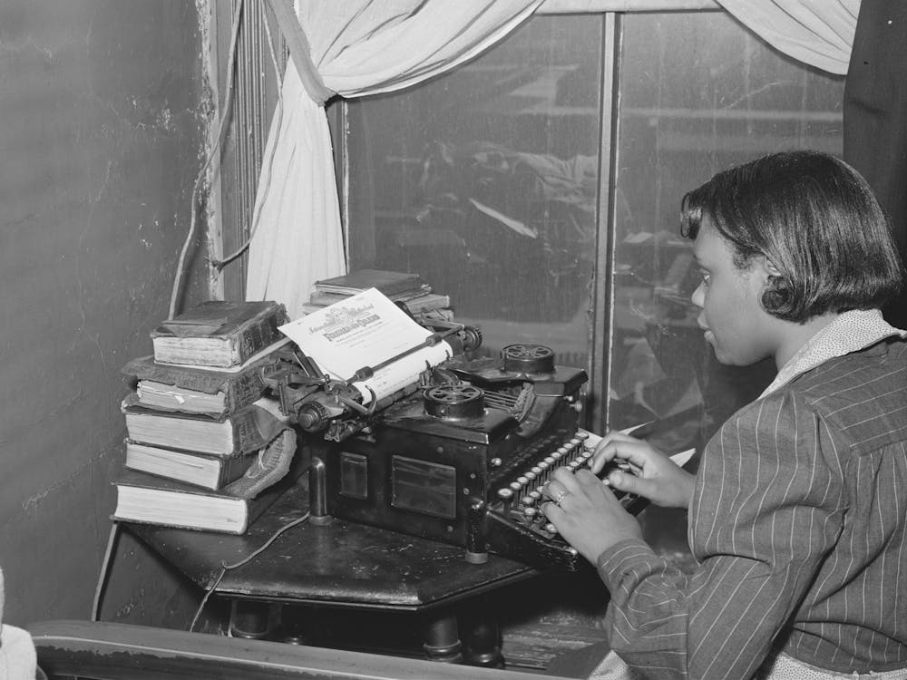 Wife Of A Railroad Worker Typing A Letter, Chicago, Illinois By Russell Lee