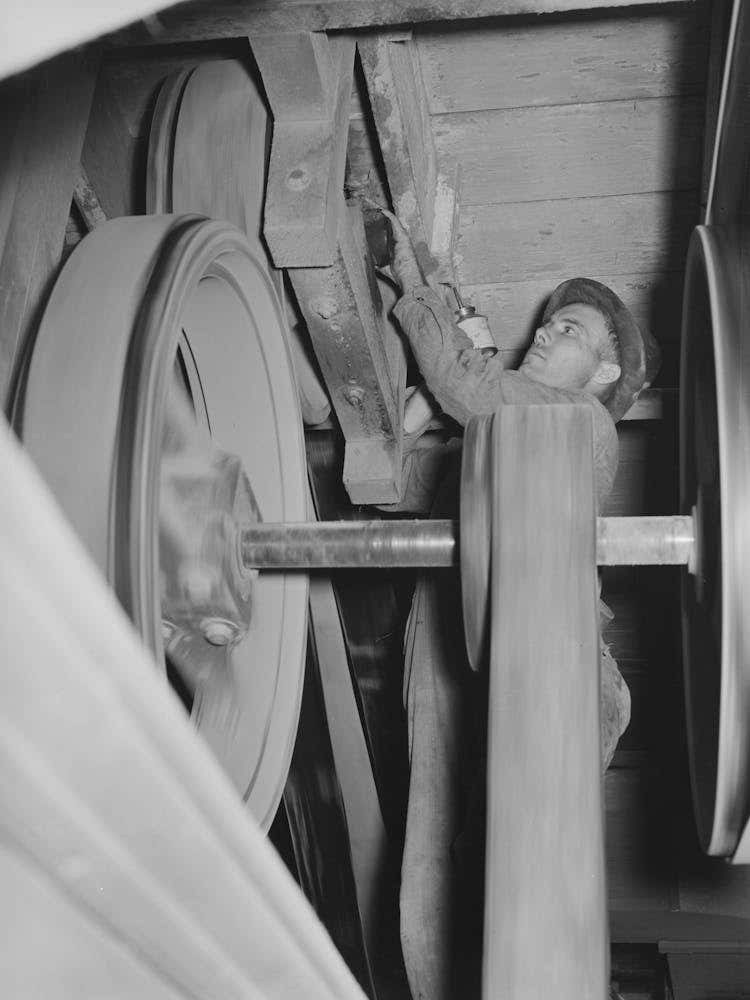 Oiling Bearings Of Pulleys, State Rice Mill, Crowley, Louisiana, Note Absence Of Guards By Russell Lee