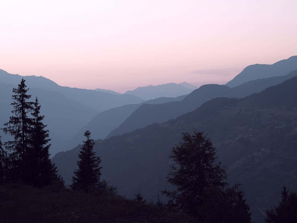 Pastel pink sunrise in the mountains of the french alps - Courchevel in France, nature and travel photography by Christa Stroo Photography