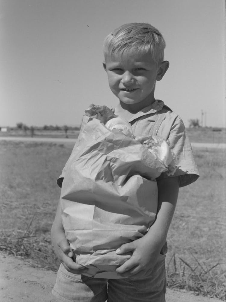 Little Boy With Sack Of Vegetables From The Community Garden At The Casa Grande Valley Farms, Pinal County