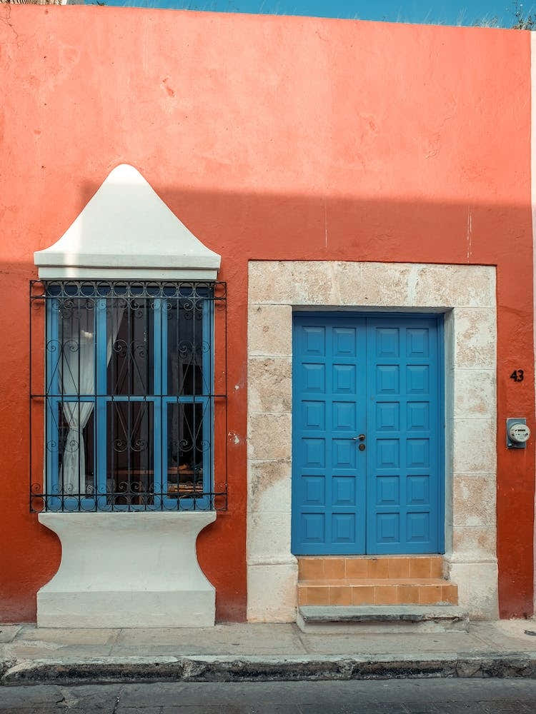 Red House With A Blue Door In Campeche Mexico