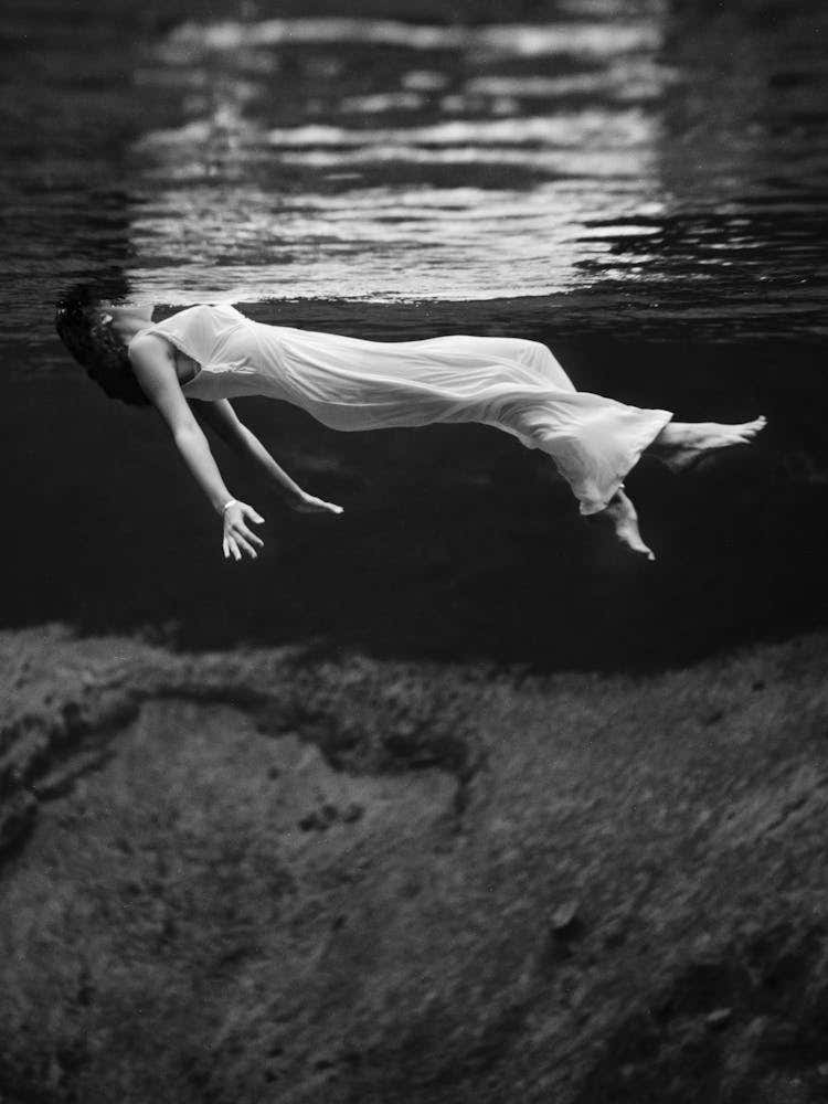 Woman In A White Dress Swimming Underwater, Vintage Black and White Old Photo