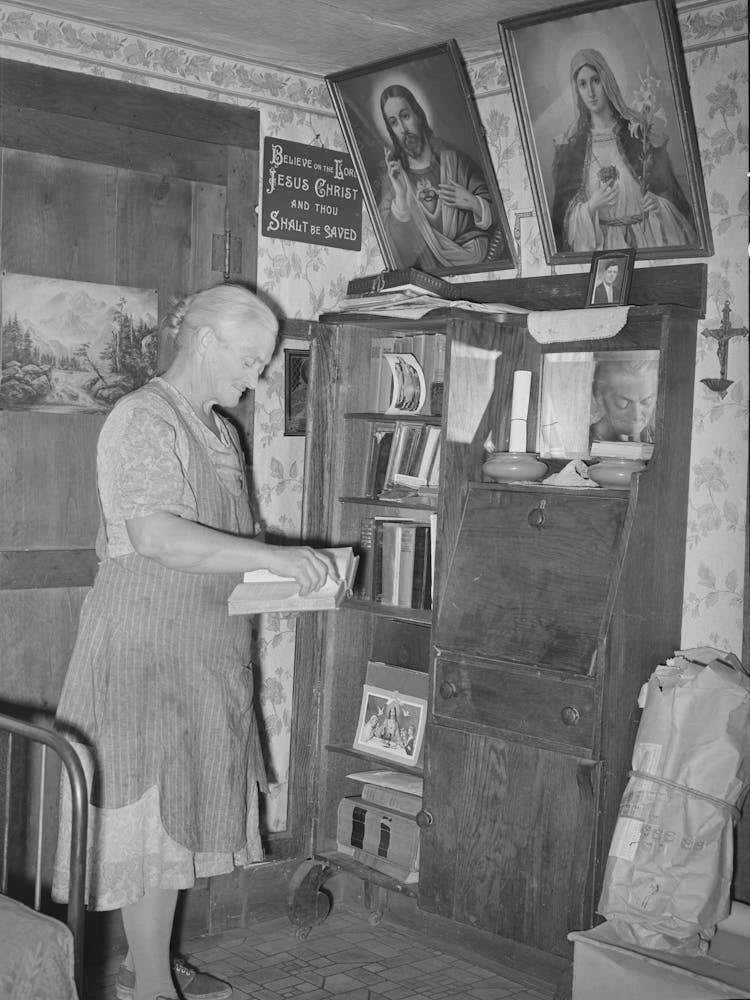 Mrs, George Hutton, Homesteader, In Front Of Her Bookcase, Pie Town, New Mexico By Russell Lee