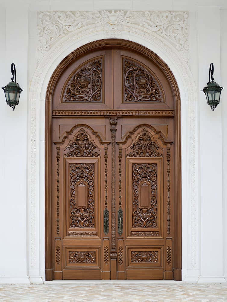 Grand Entrance – An Ornate Wooden Doorway with Intricate Carvings