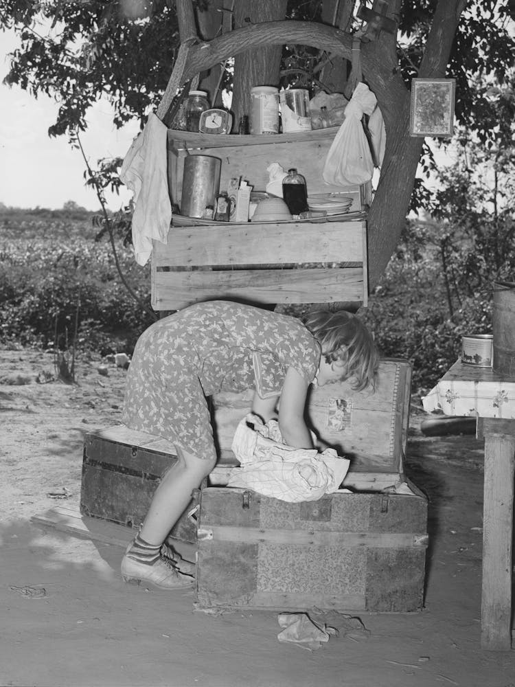 Migrant Child Packing A Trunk At Camp Home Near Muskogee, Oklahoma, Muskogee County By Russell Lee