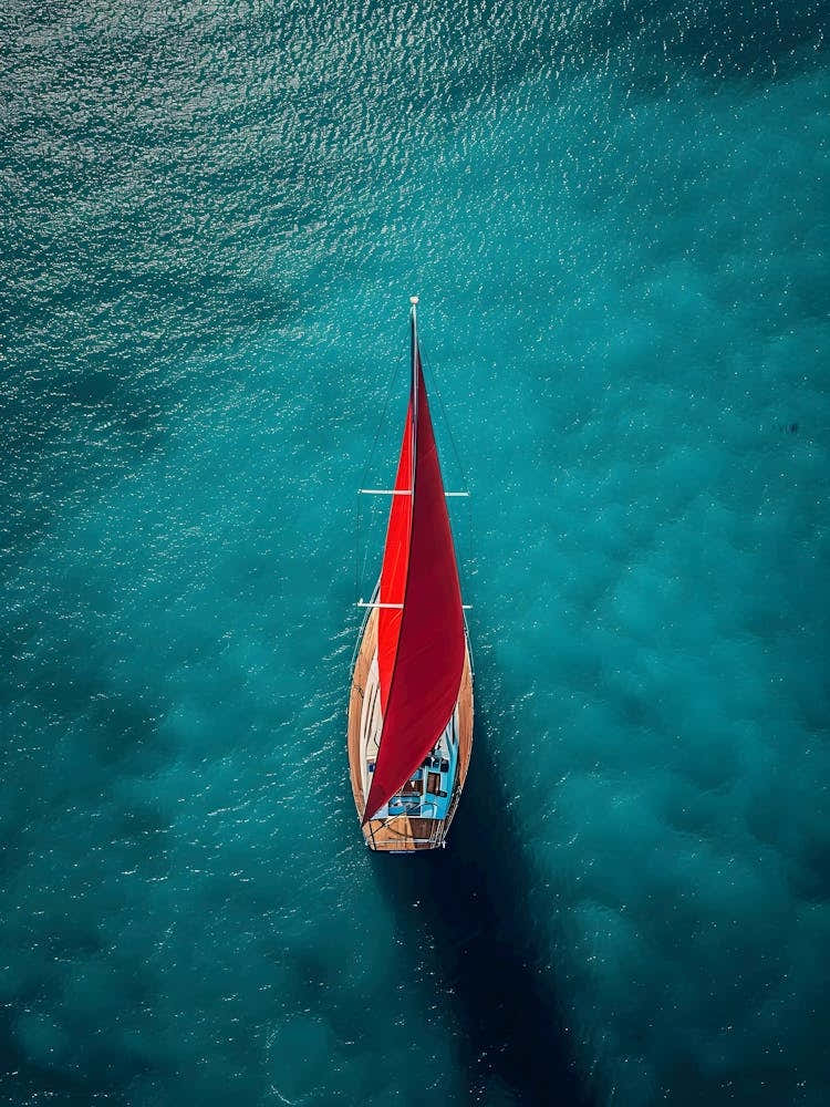 Red Sailboat In The Sea