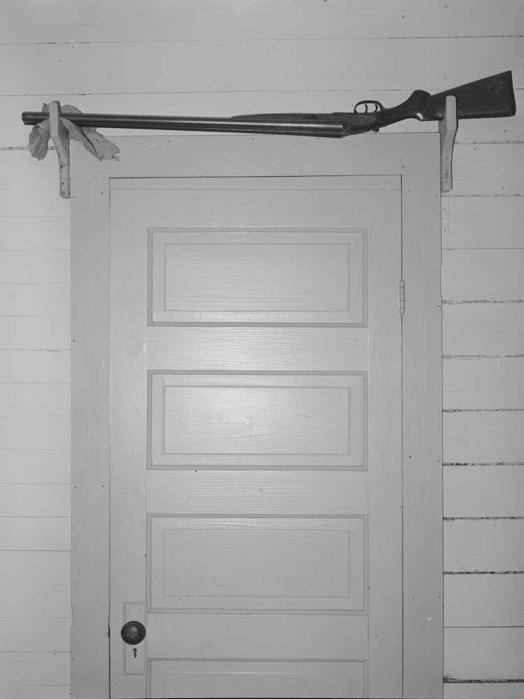 Shotgun Over The Door For Sake Of Quick Availability In Farmer S Home, Crowley, Louisiana By Russell Lee