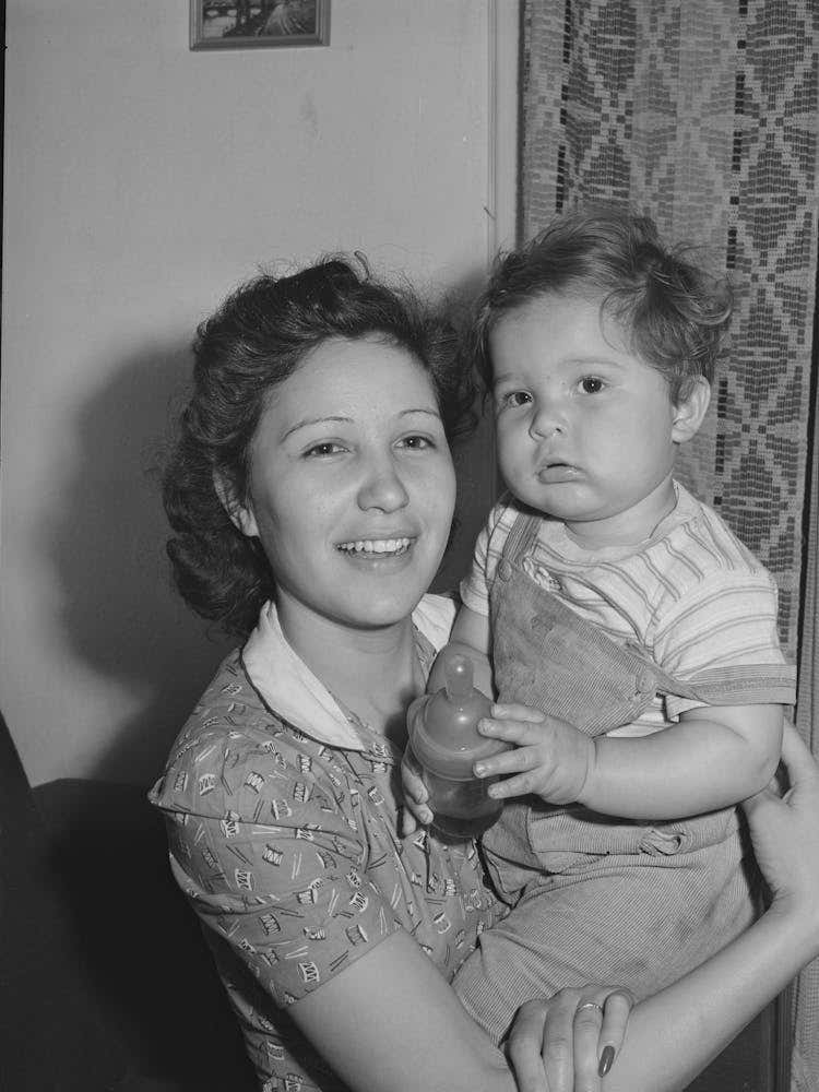 Mother And Child Who Have Moved To San Diego From San Angelo, Texas, The House This Family Lives In Rented For