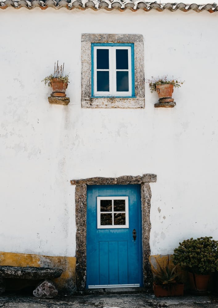 The Tiny Blue Door In A Village In Portugal