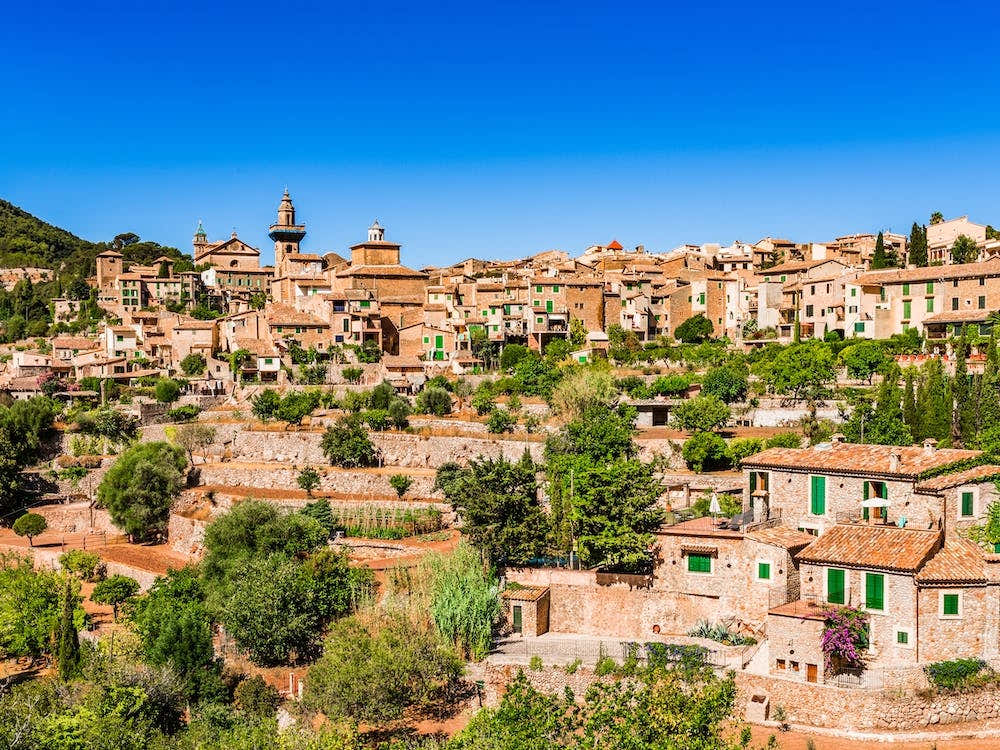 Idyllic view of Valldemossa, mediterranean Mallorca village at Spain. Village landscape of Valldemossa on Majorca, Spain Balearic Islands. A serene village landscape of Valldemossa, nestled in the scenic Balearic Islands of Spain.
