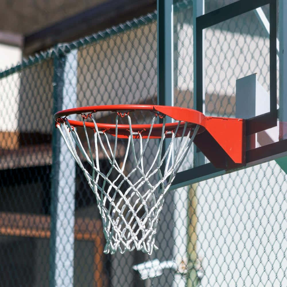A Basketball Hoop In A Playground
