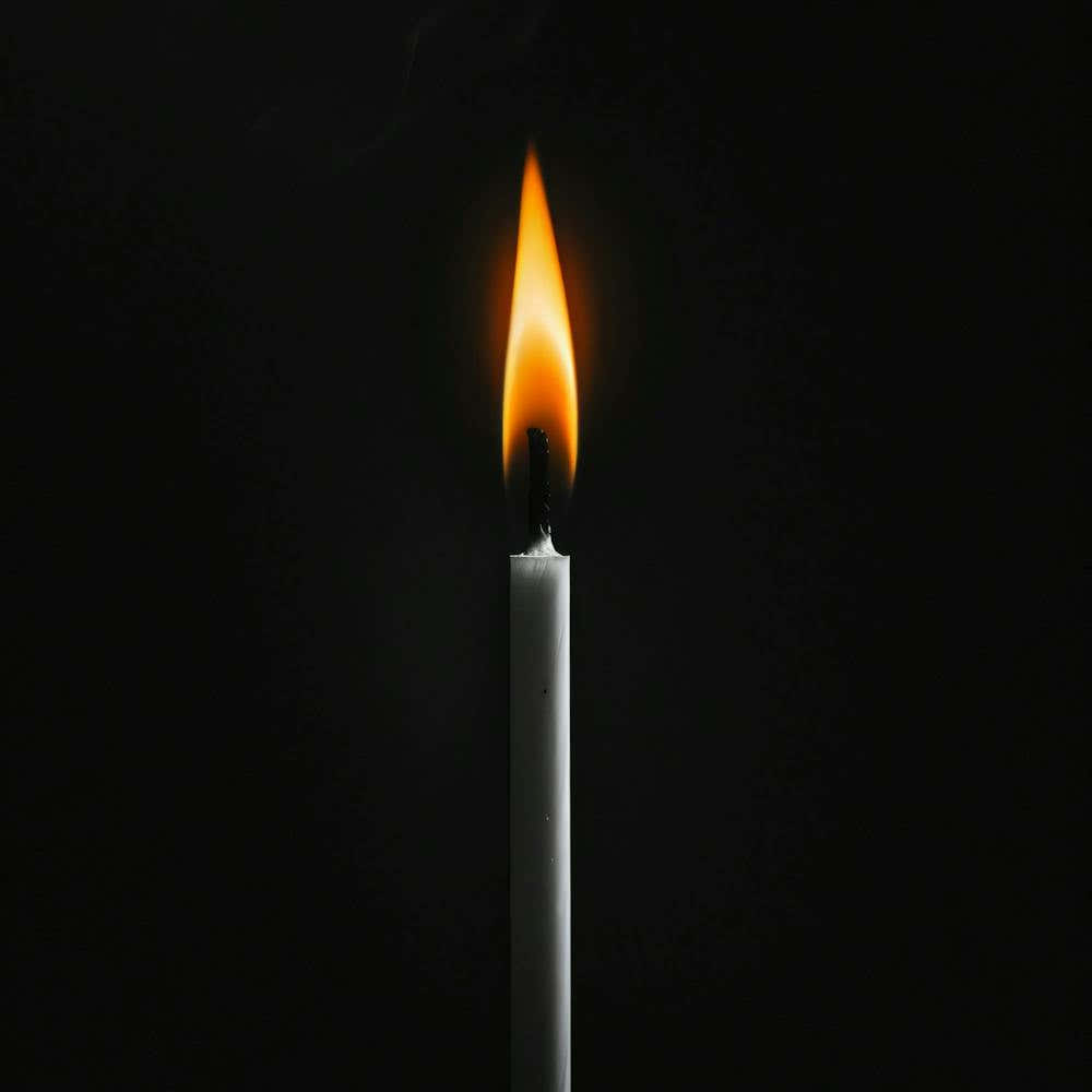 Candle On A Black Background