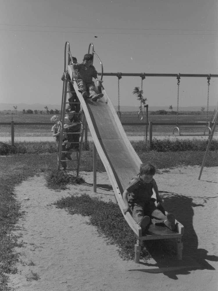 Untitled Photo Possibly Related To Children Playing On Slide At Fsa (Farm Security Administration) Labor Camp 1