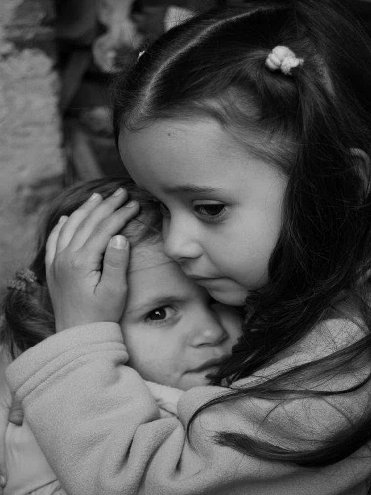 Two Little Girls Hugging