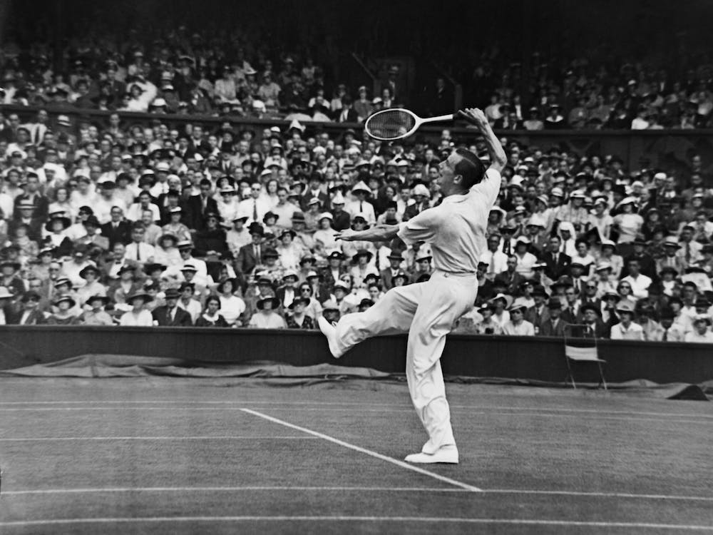 Fred Perry (pictured) competing at The Wimbledon Tennis Championships against John Van Ryn of the USA