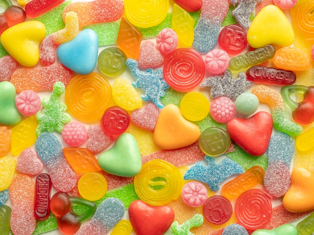 Rainbow colors sugar sweets with dinosaurs - great for a kids room - Fun food photography by Christa Stroo Photography