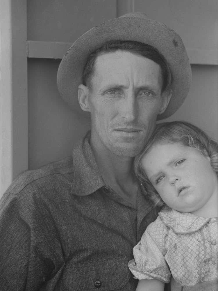 Migrant Worker And His Child At The Agua Fria Migratory Labor Camp, Arizona By Russell Lee