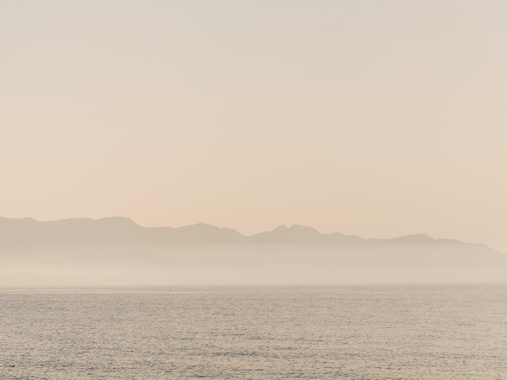 Seascape In Sicily While The Sun Goes Down In Pastel On An Island In The Mediterranean Sea