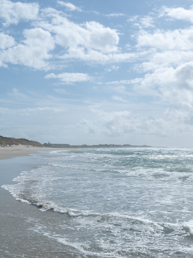 Summer surf beach with pastel blue sky and ocean in Norway - boho coast nature and travel photography by Christa Stroo Photogaphy