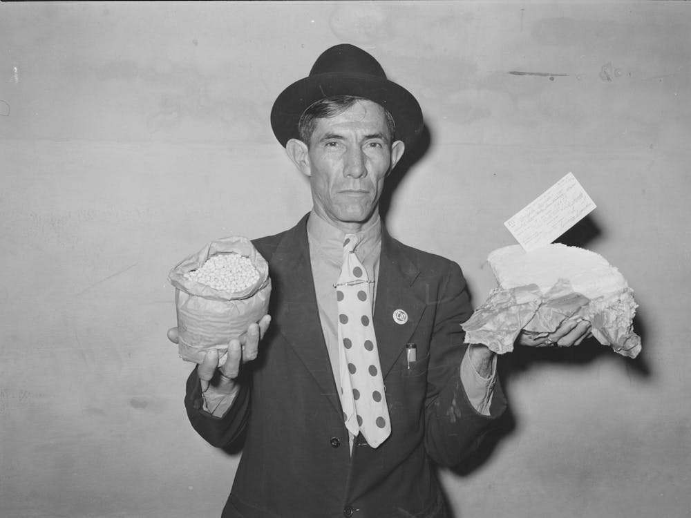 Mexican Pecan Workers Union Official Displaying Relief Supplies Which Are Supposed To Feed A Family Of Three For