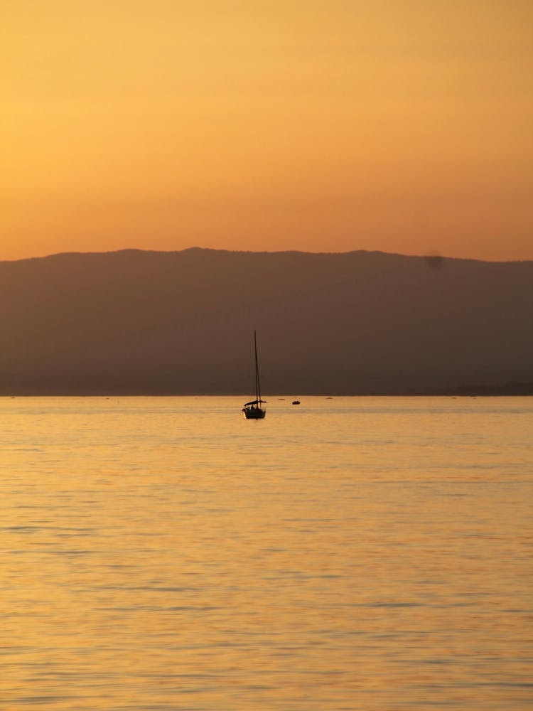 Sailboat At Sunset