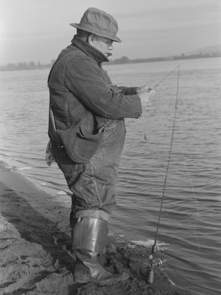 Fisherman On Banks Of Columbia River, Cowlitz County, Washington By Russell Lee