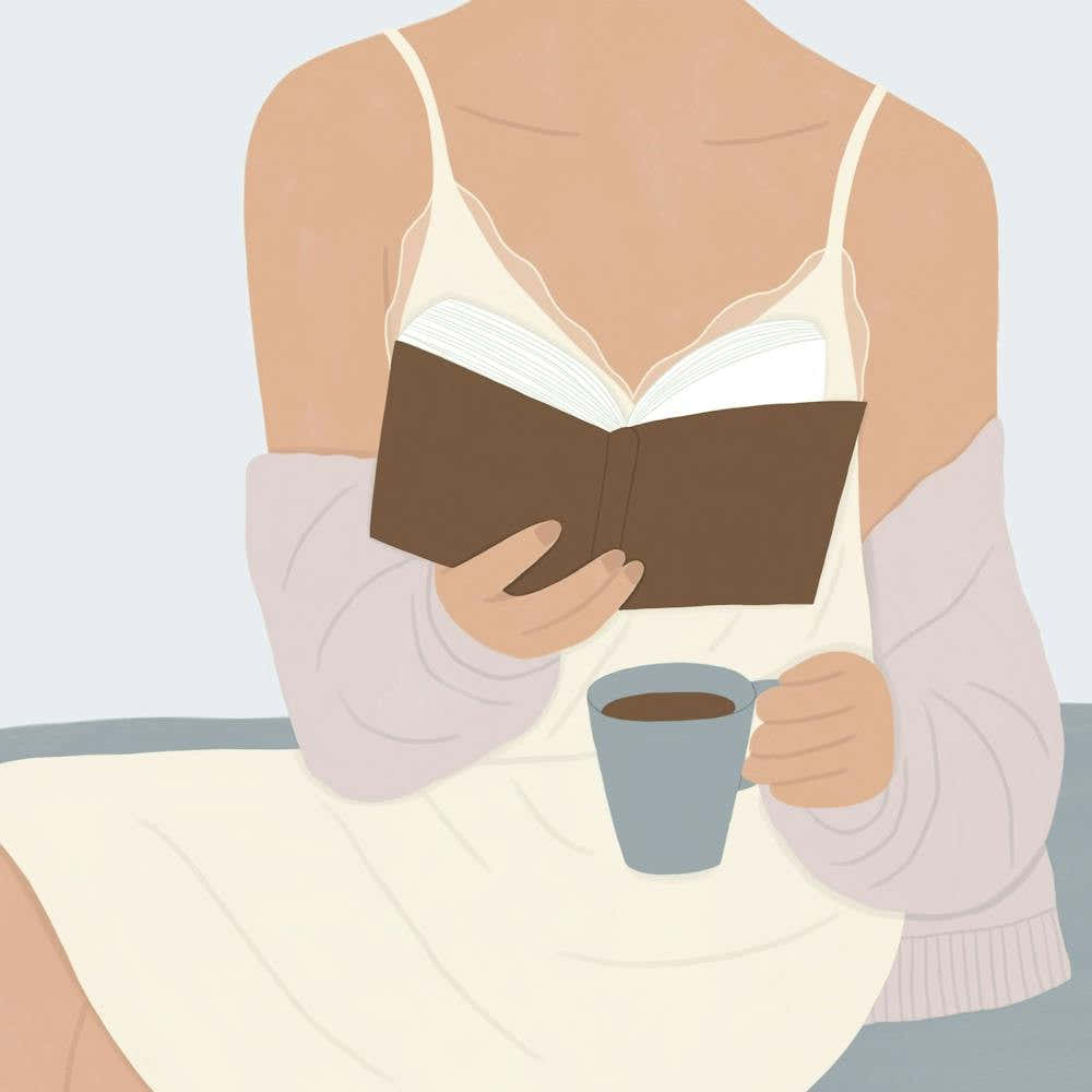 Woman Reading A Book With A Coffee