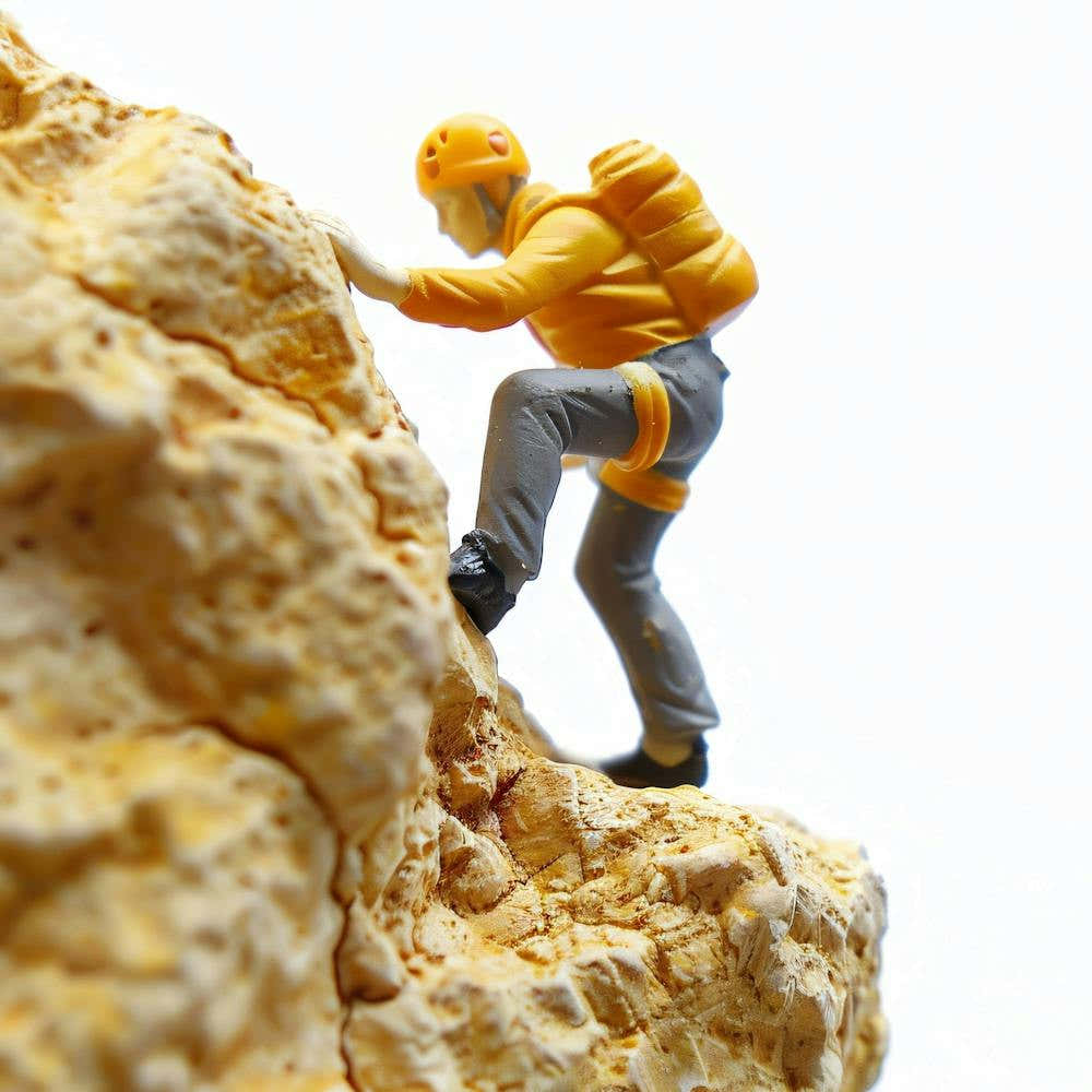 Climber Climbing A Rock