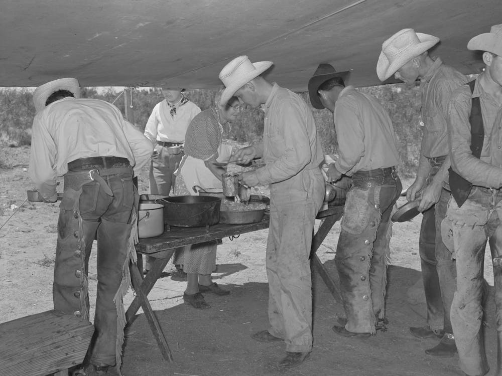 Cowboys Of The Sms Ranch Serving Themselves At Dinner At Chuck Wagon, Ranch Near Spur, Texas By Russell Lee