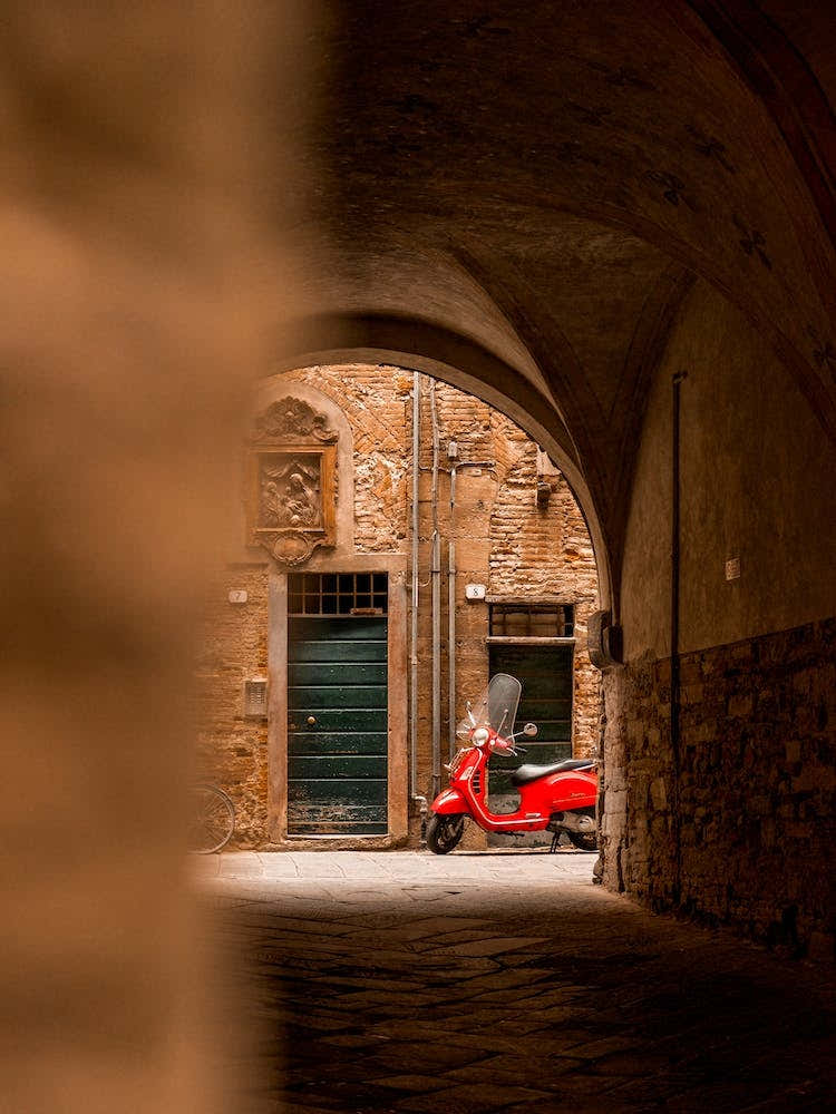 Red Vespa In Lucca Tuscany