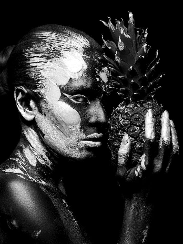 Black And White Portrait Of A Woman Holding A Pineapple