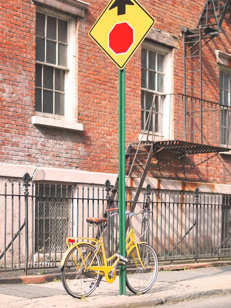 New York, USA I NYC's yellow bike on the streets to the new yorker loft brick architecture of West Village, Brooklyn or Soho for minimalist geometric photography with the retro vintage aesthetic