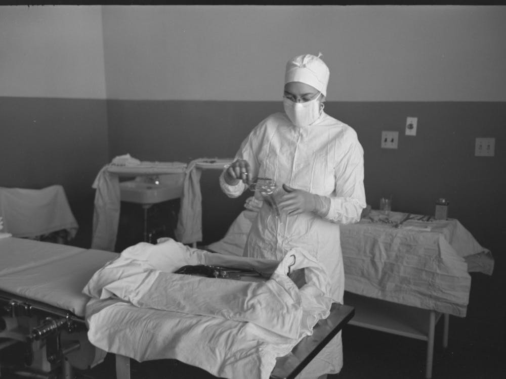 Sterile Nurse Lays Out Instruments For Operation At The Cairns General Hospital At The Fsa (Farm Security