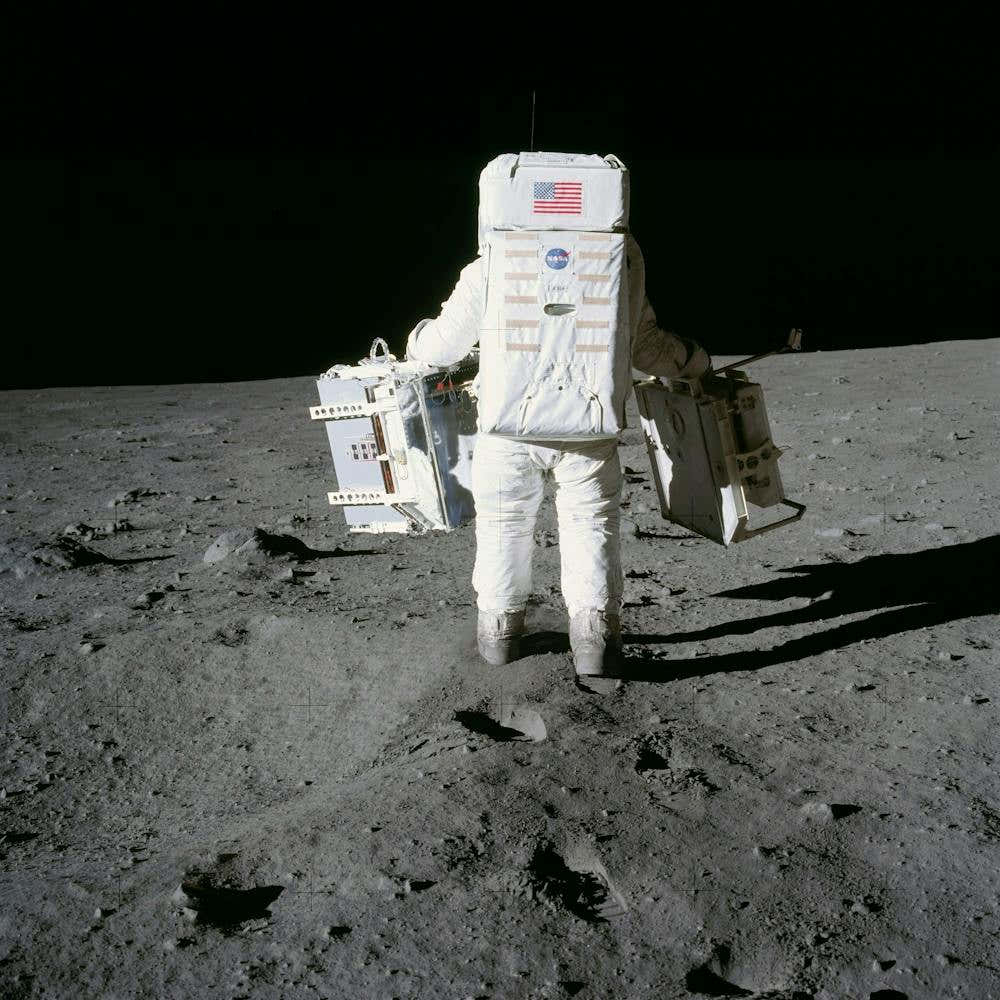 Astronaut Edwin Aldrin Prepares To Deploy Two Components Of The Early Apollo Scientific Experiments Package (Easep)