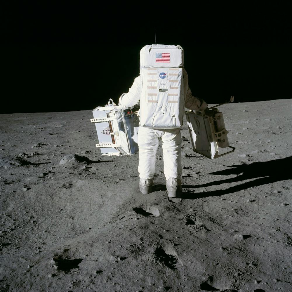 Astronaut Edwin Aldrin Prepares To Deploy Two Components Of The Early Apollo Scientific Experiments Package (Easep)