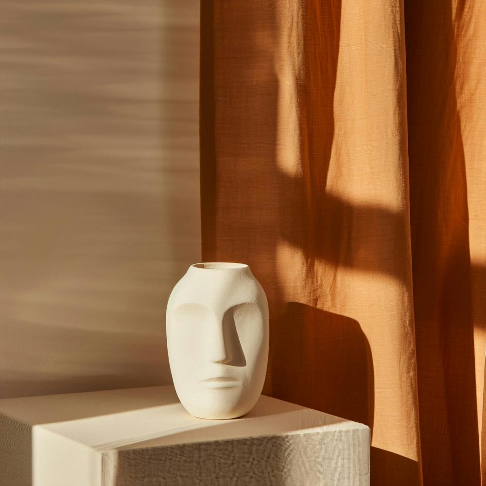 A Beige Vase with Shadows Show Product Stock Photography 11