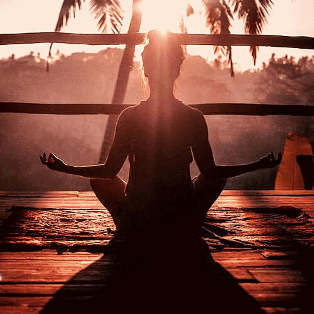 Silhouette Of Woman Meditating
